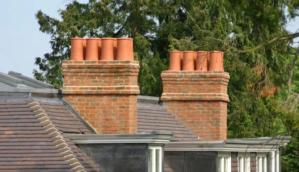 Brick chimneys with clay pots