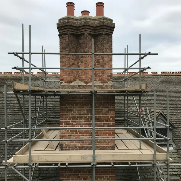 Brick chimney viewed from scaffolding