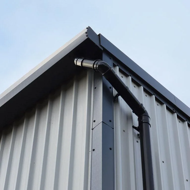 Metal-clad gable with black rainwater pipework