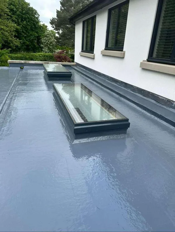 Flat waterproofing surface with two rooflights