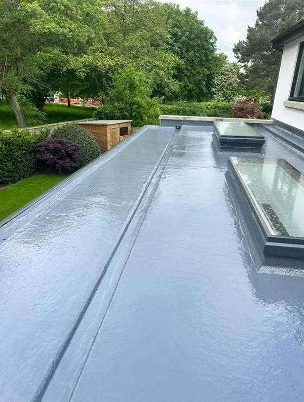 Wide flat waterproofing surface with two rooflights