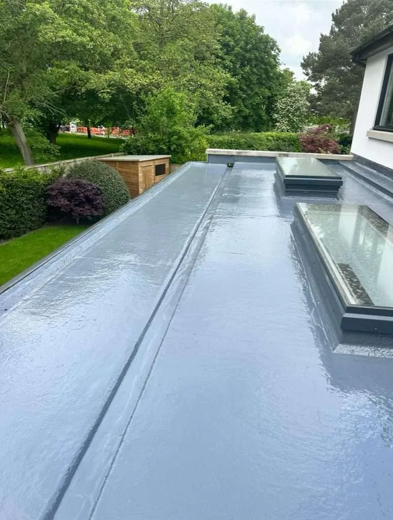 Wide flat waterproofing surface with two rooflights