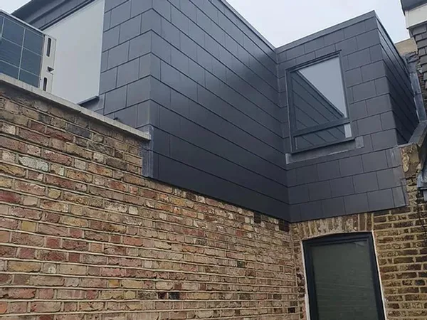 Slate-clad dormer and roof edge