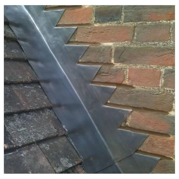 Lead flashing at brickwork and a slate roof