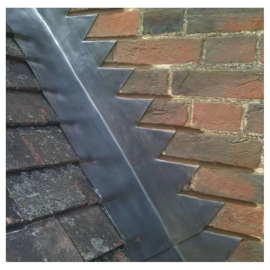 Lead flashing at brickwork and a slate roof